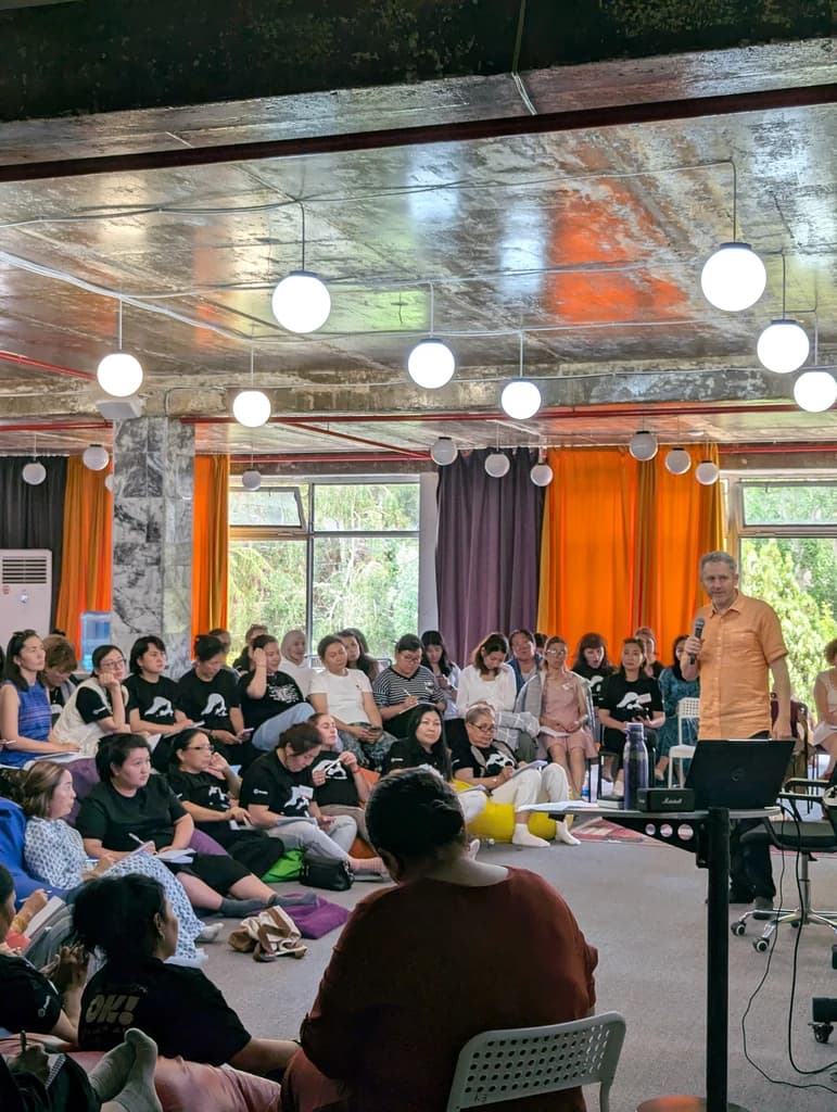 Misha Leder facilitating a workshop or group session